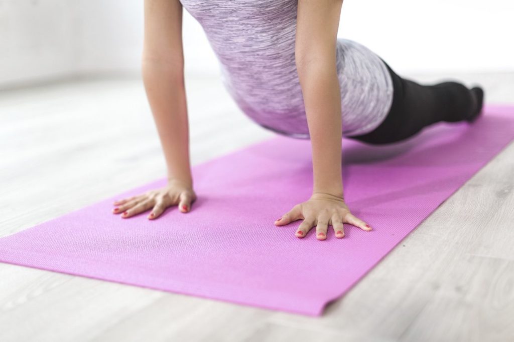Free woman doing yoga pose